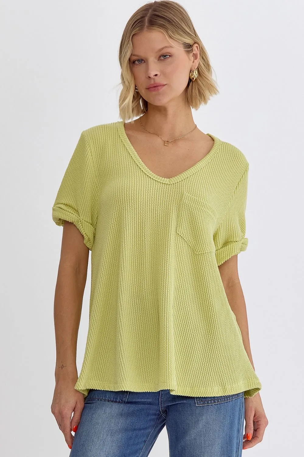 Erica V-neck short sleeve top featuring rolled sleeve hem and pocket at bust In Lime