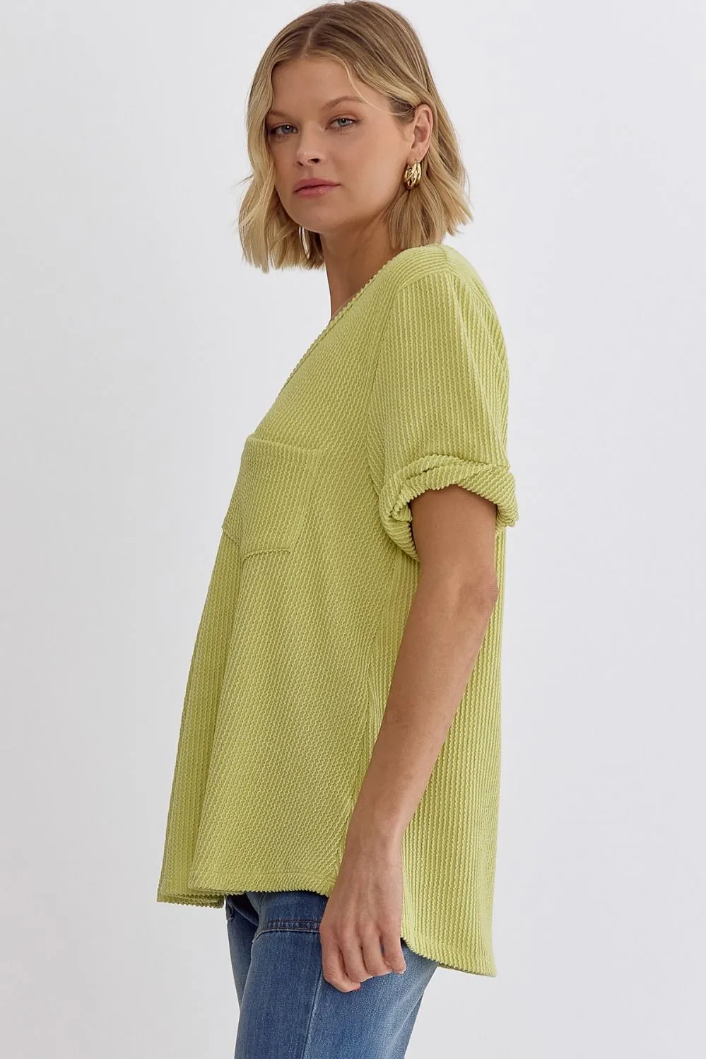Erica V-neck short sleeve top featuring rolled sleeve hem and pocket at bust In Lime