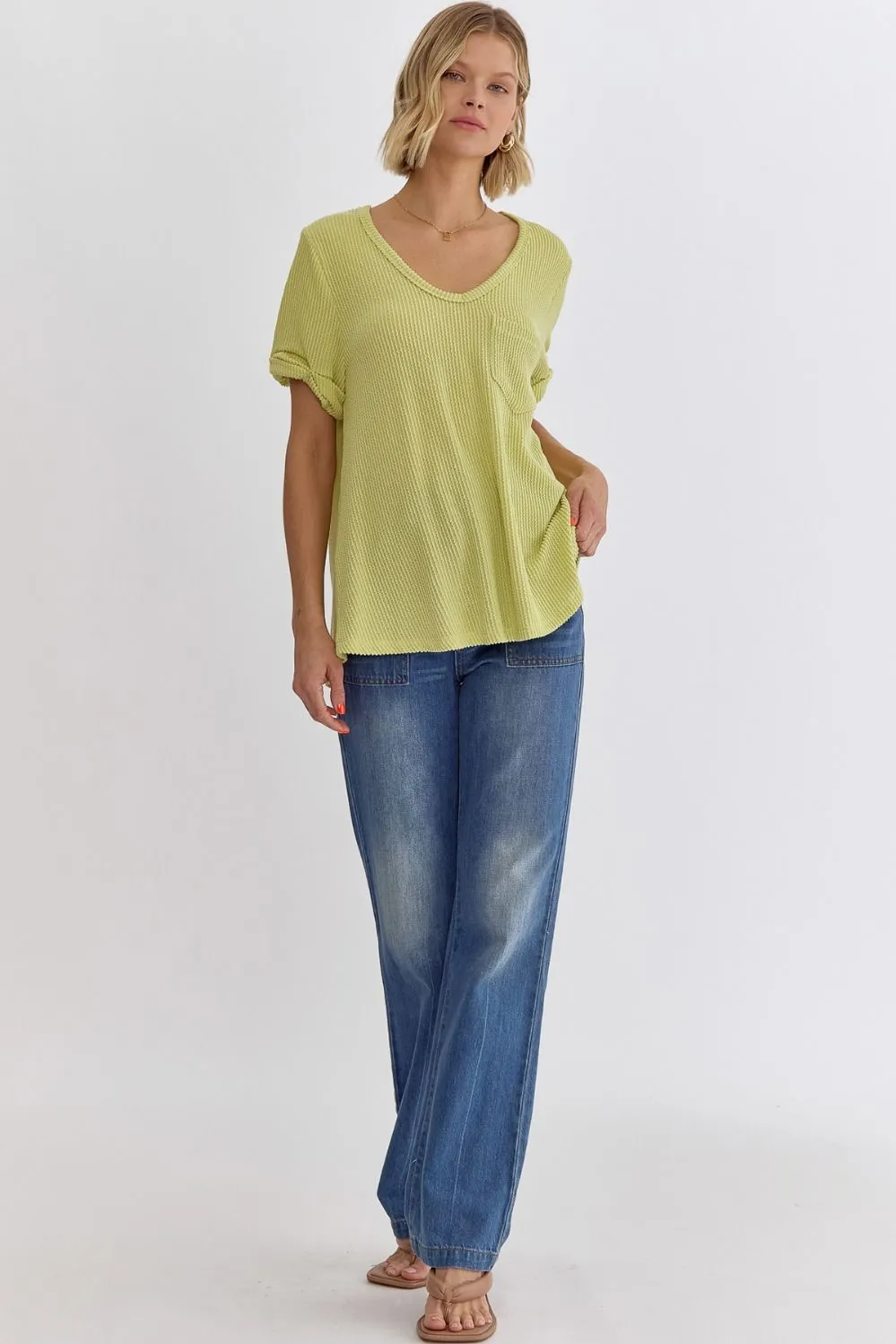 Erica V-neck short sleeve top featuring rolled sleeve hem and pocket at bust In Lime